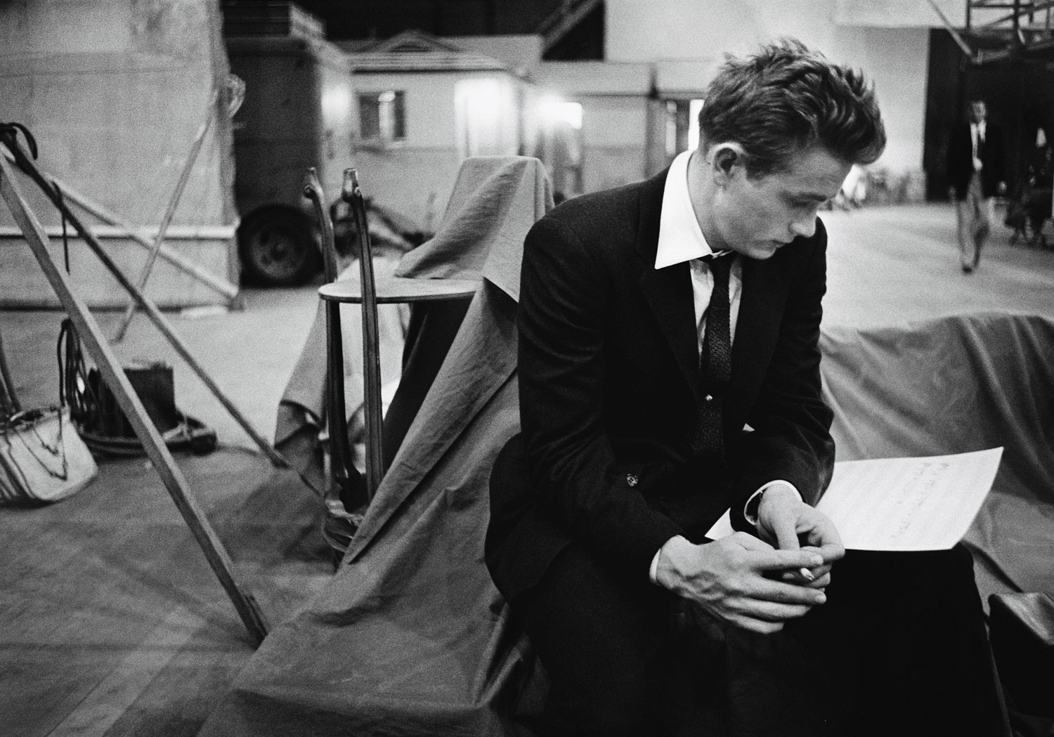 James Dean goes over his script on the set of 
